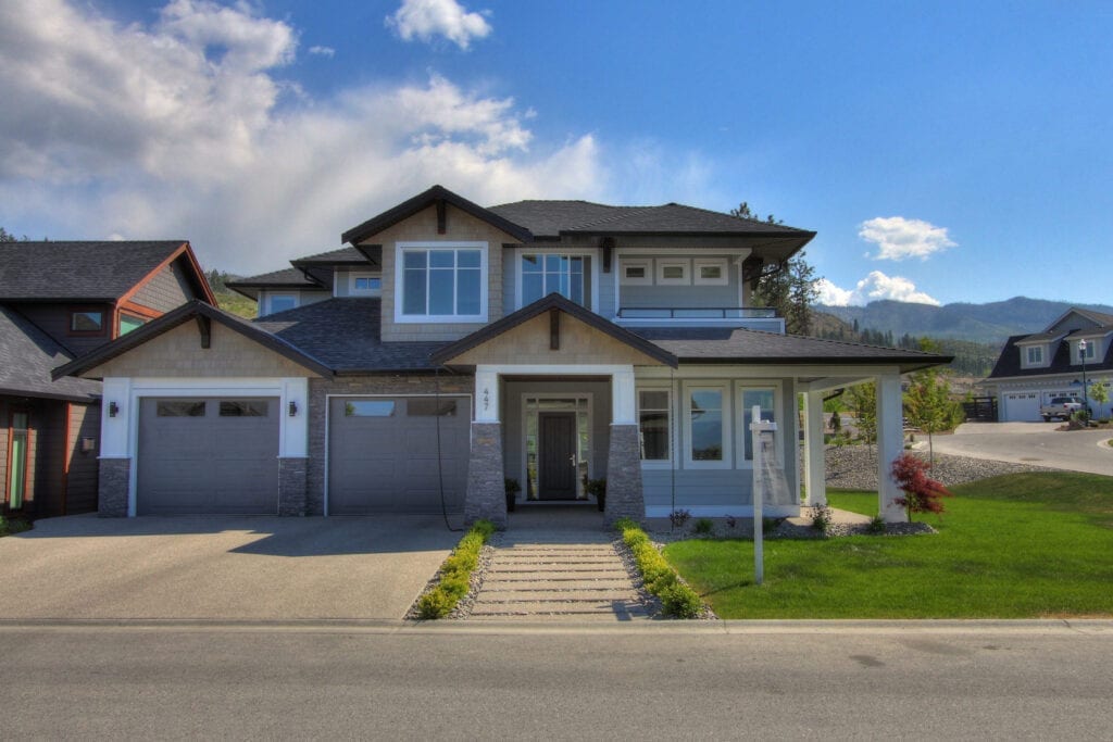Custom home build front at 447 Lakepoint Drive in Kelowna with double garage