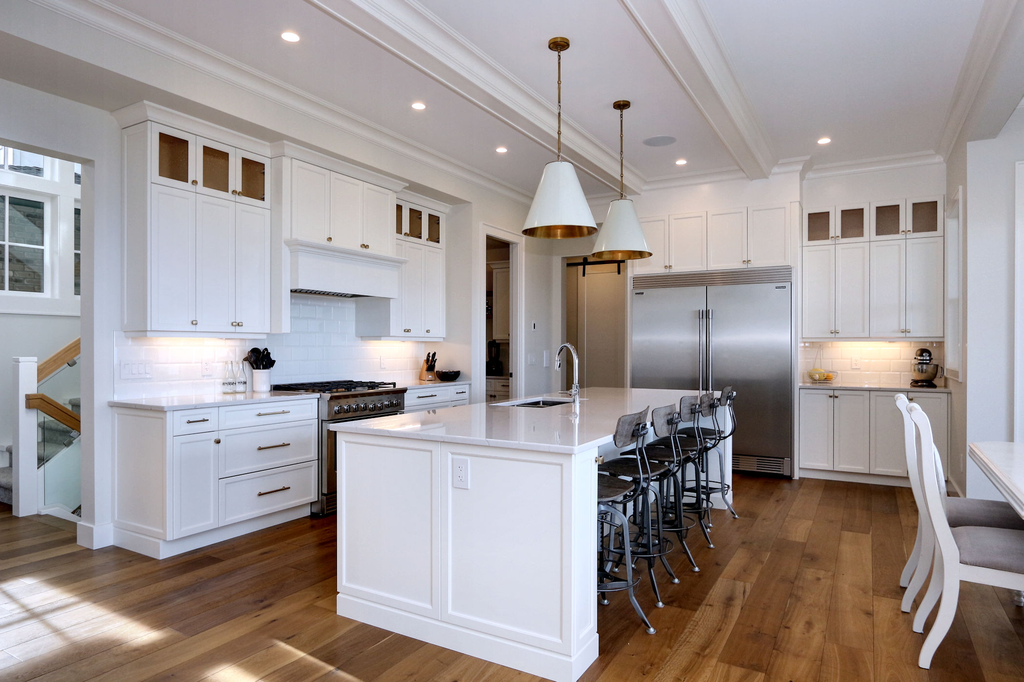 Open concept kitchen with large white island at 470 Rockview Lane, a custom home build and interior design by Stark Homes
