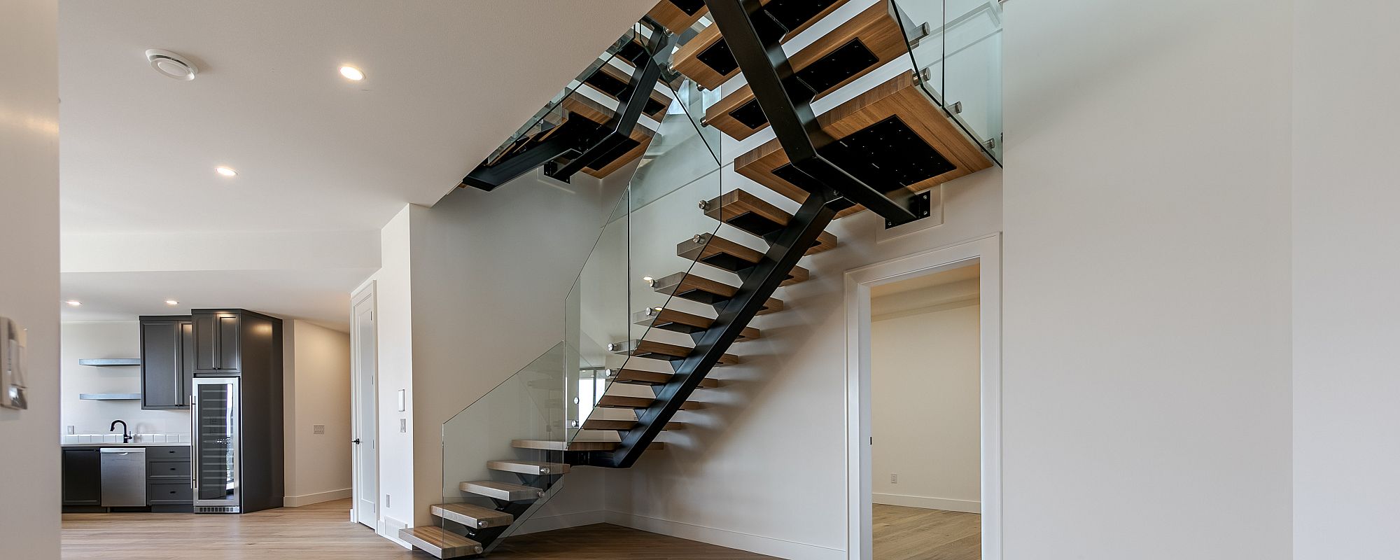 Feature staircase with wooden steps and black beams