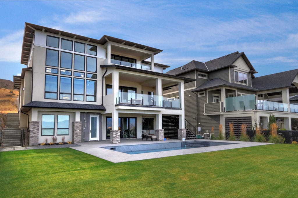 Custom home built by Stark Homes, including many desirable home features for Okanagan summers, like an in ground pool and patio. 